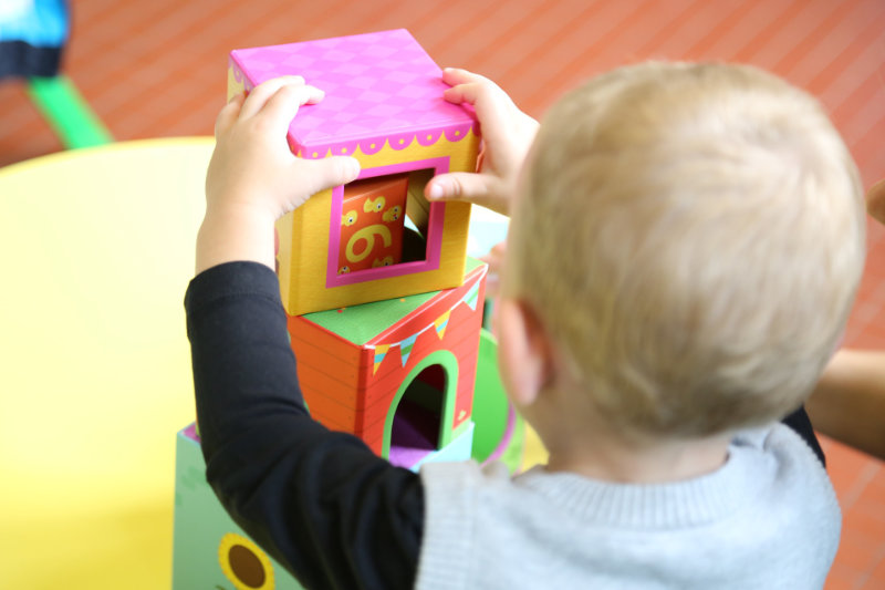 May child playing with bricks